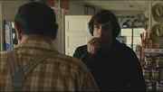 During the scene when Anton Chigurh makes the store clerk call a coin flip for his life, there is a new Jack Links beef jerky display behind Anton. The movie was set in the 1980s.
